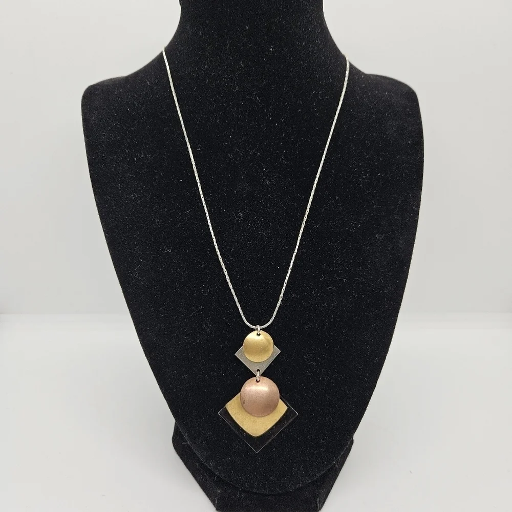 silver tone chain necklace with multi-tone geometric pendant
